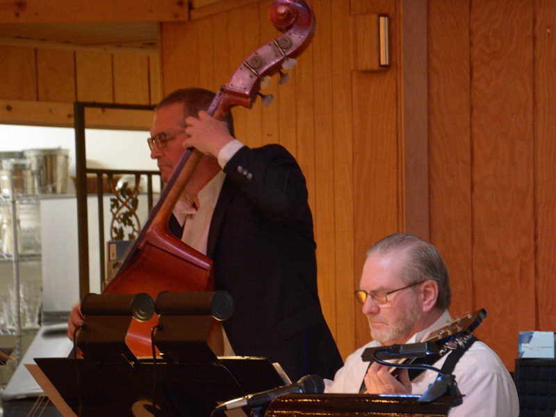 Charlie Vining on bass and Ron Hackett on guitar